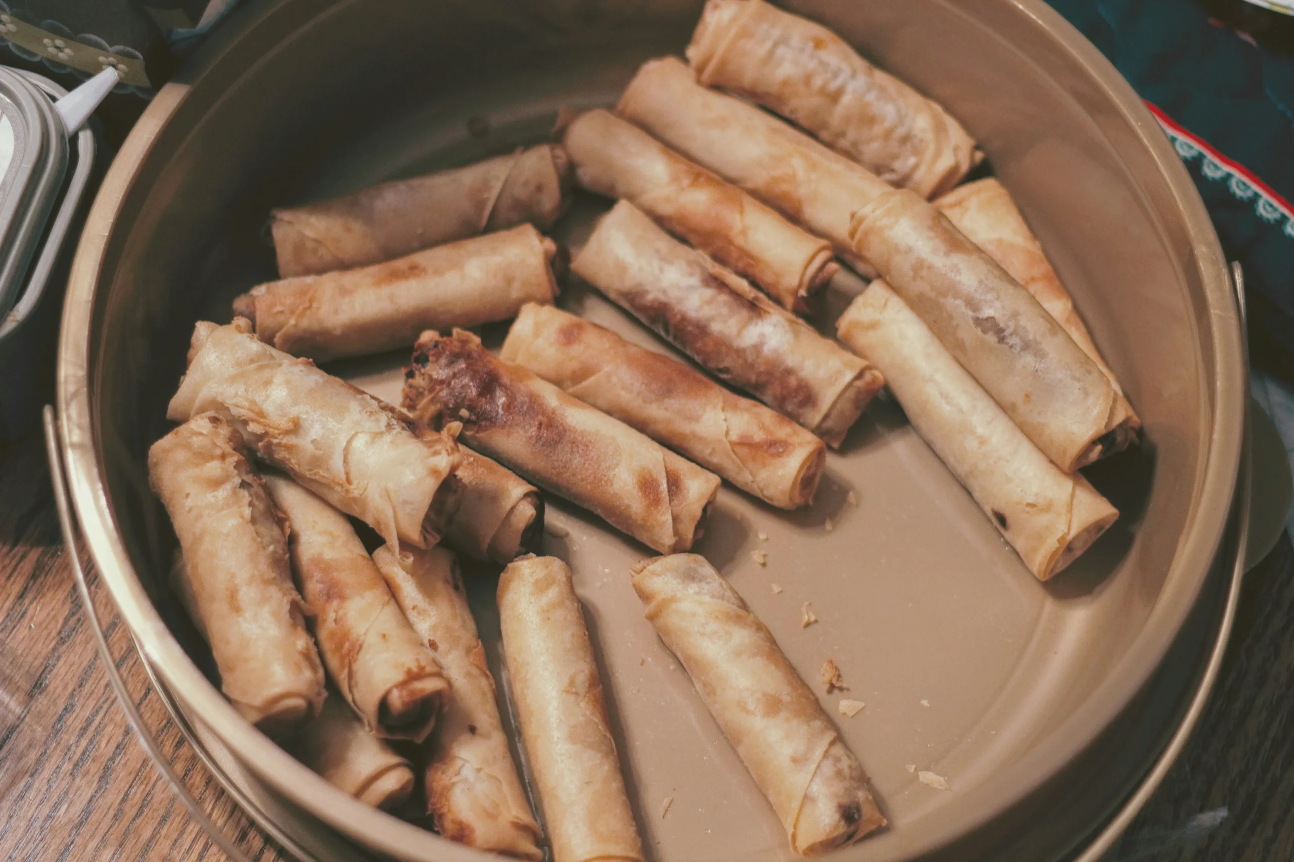 Swiss Chalet Chicken Spring Rolls — crispy hand-rolled appetizers served with tangy plum dipping sauce