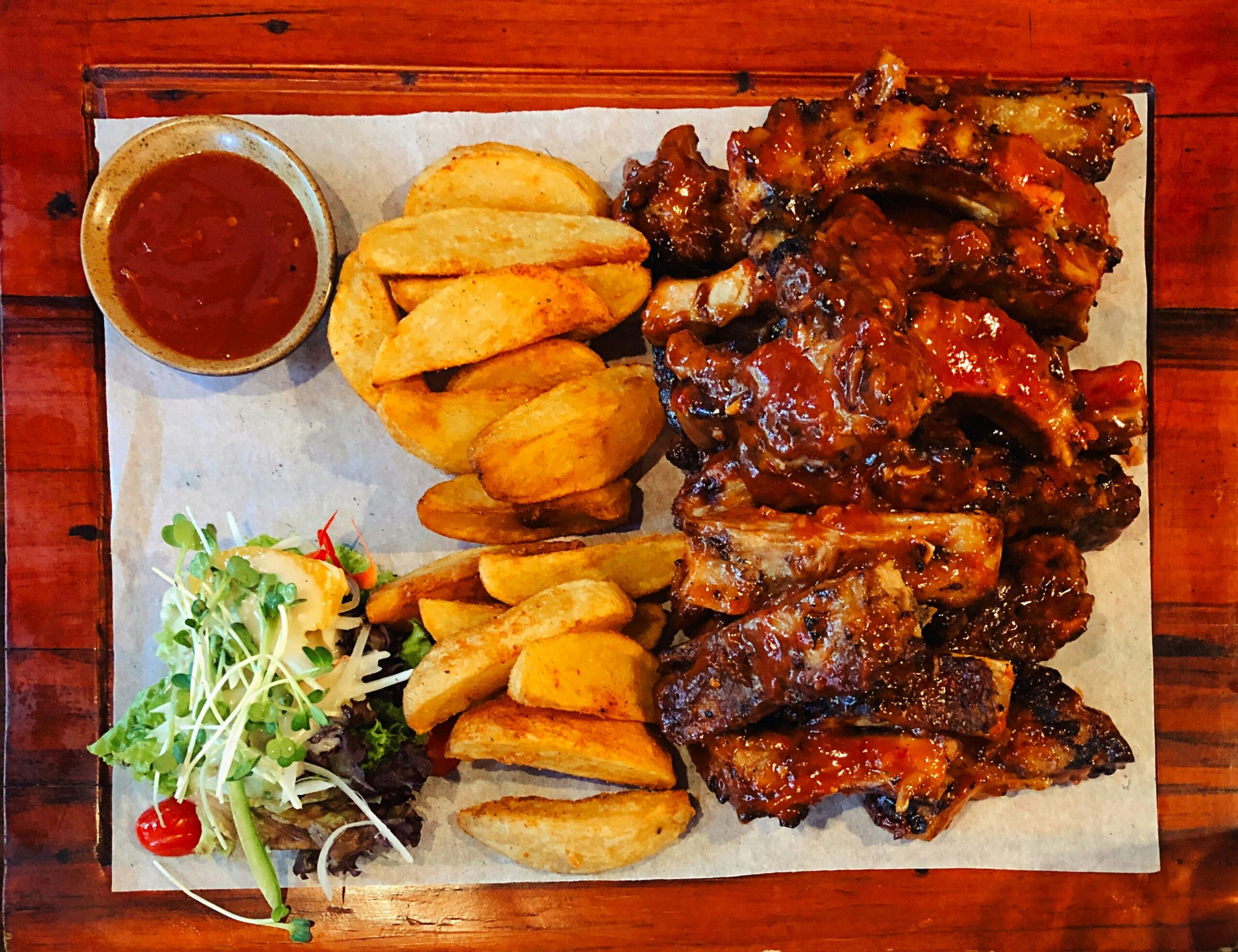 Swiss Chalet Chicken & Ribs Family Pak — whole rotisserie chicken, half rack BBQ ribs, 4 rolls and choice of 4 sides